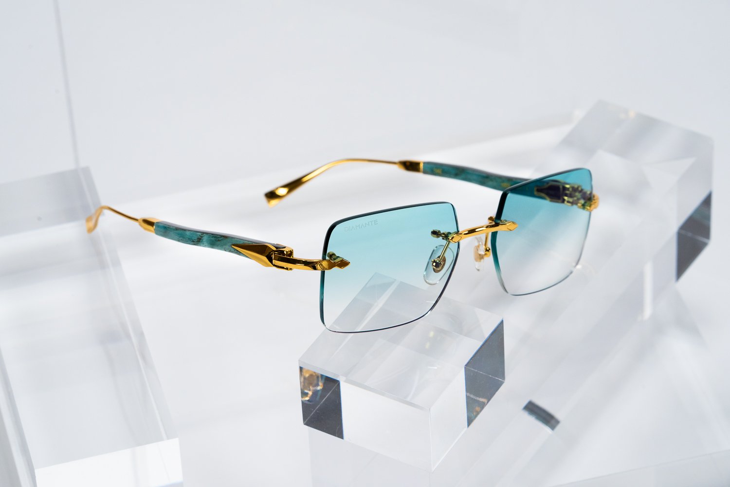 Diamante rimless frame with turquoise gradient diamond cut lenses and jeweled temples